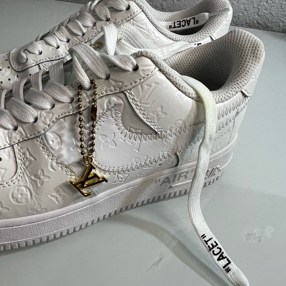 Nike White Sneakers with Gold Accent